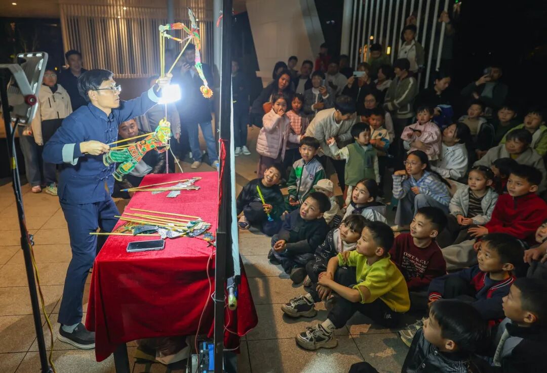 A free evening show for neighborhood families, children sitting up front
