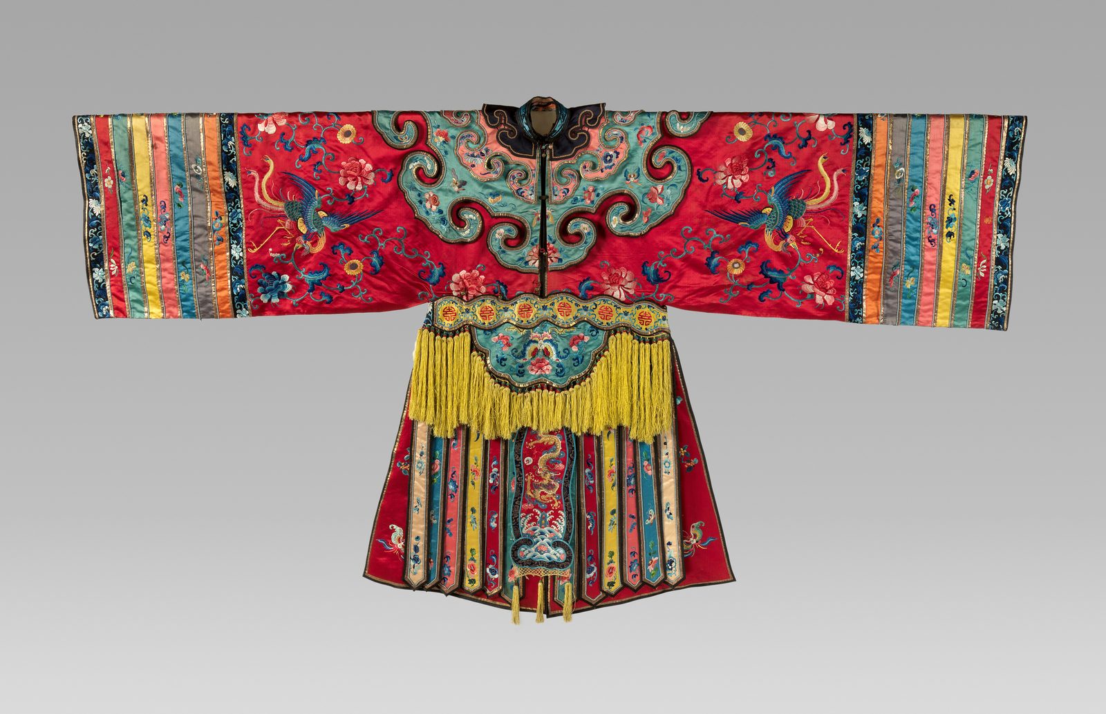 A 19th-century Chinese theatrical robe embroidered with phoenixes and flowers in vivid silk threads